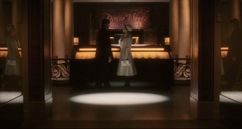 Movie still from “The Fountain” (2006), directed by Darren Aronofsky – Two people are walking in front of a bar; Wide shot, Low angle
