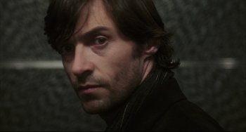 Movie still from “The Fountain” (2006), directed by Darren Aronofsky – A person with long hair; Close Up shot, Over the shoulder angle