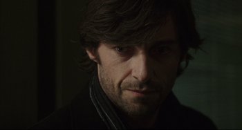 Movie still from “The Fountain” (2006), directed by Darren Aronofsky – A person wearing a black jacket; Close Up shot, Over the shoulder angle