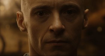 Movie still from “The Fountain” (2006), directed by Darren Aronofsky – A man's face in a dimly - lit room; Extreme Close Up shot, Low angle