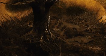 Movie still from “The Fountain” (2006), directed by Darren Aronofsky – An image of a man in the woods near a tree; Extreme Wide shot, High angle