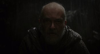 Movie still from “The Fountain” (2006), directed by Darren Aronofsky – An old man with a beard is looking at the camera; Close Up shot, Over the shoulder angle