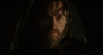 Movie still from “The Fountain” (2006), directed by Darren Aronofsky – A person with a wet beard; Close Up shot, Low angle
