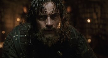 Movie still from “The Fountain” (2006), directed by Darren Aronofsky – A person with a beard; Close Up shot, Low angle