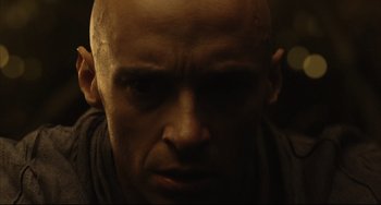 Movie still from “The Fountain” (2006), directed by Darren Aronofsky – A man with a bald head is looking at the camera; Close Up shot, Low angle
