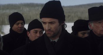 Movie still from “The Fountain” (2006), directed by Darren Aronofsky – A group of men standing next to each other in the snow; Close Up shot, Over the shoulder angle