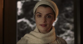 Movie still from “The Fountain” (2006), directed by Darren Aronofsky – A person wearing a hat and a scarf; Close Up shot, High angle