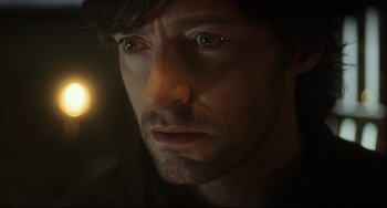 Movie still from “The Fountain” (2006), directed by Darren Aronofsky – A person looking at the camera; Close Up shot, Over the shoulder angle