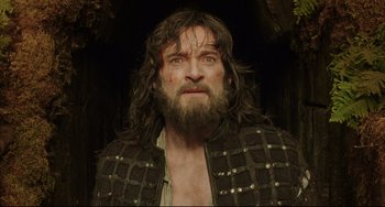 Movie still from “The Fountain” (2006), directed by Darren Aronofsky – A man with long hair and a beard; Close Up shot, Low angle