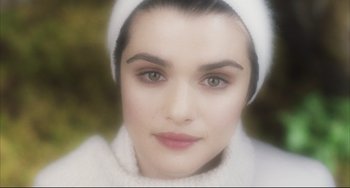 Movie still from “The Fountain” (2006), directed by Darren Aronofsky – A woman wearing a white hat; Close Up shot, High angle