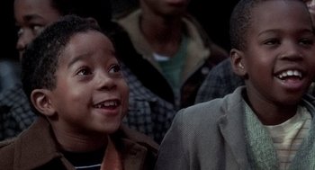 Movie still from “The French Connection” (1971), directed by William Friedkin – A group of young people standing next to each other; Close Up shot, High angle