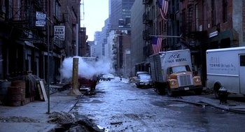 Movie still from “The French Connection” (1971), directed by William Friedkin – A street scene with steam coming out of the back of a fire truck; Extreme Wide shot, High angle