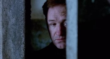 Movie still from “The French Connection” (1971), directed by William Friedkin – A person looking at the camera; Close Up shot, Low angle