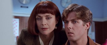 Movie still from “The Frighteners” (1996), directed by Peter Jackson – A woman and a young man are looking at the camera; Close Up shot, Low angle