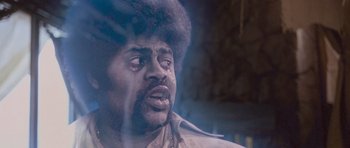 Movie still from “The Frighteners” (1996), directed by Peter Jackson – A person with a beard crying; Close Up shot, Low angle