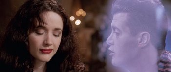 Movie still from “The Frighteners” (1996), directed by Peter Jackson – A woman and a man are looking into each other's eyes; Close Up shot, Over the shoulder angle