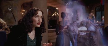 Movie still from “The Frighteners” (1996), directed by Peter Jackson – A woman talking to a man in front of a mirror; Medium shot, Over the shoulder angle
