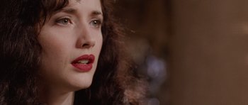 Movie still from “The Frighteners” (1996), directed by Peter Jackson – A person with long curly hair; Close Up shot, Over the shoulder angle