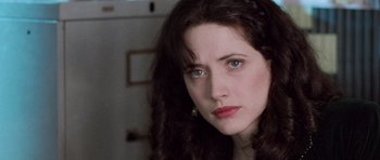 Movie still from “The Frighteners” (1996), directed by Peter Jackson – A person with long hair; Close Up shot, High angle