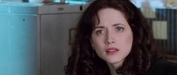 Movie still from “The Frighteners” (1996), directed by Peter Jackson – A person with long brown hair; Close Up shot, Over the shoulder angle