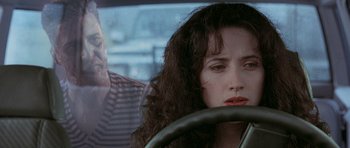 Movie still from “The Frighteners” (1996), directed by Peter Jackson – A woman sitting in the drivers seat of a car; Close Up shot, Over the shoulder angle