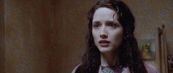Movie still from “The Frighteners” (1996), directed by Peter Jackson – A person with long curly hair; Close Up shot, Over the shoulder angle