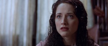 Movie still from “The Frighteners” (1996), directed by Peter Jackson – A person with curly hair; Close Up shot, Over the shoulder angle