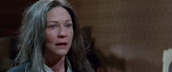 Movie still from “The Frighteners” (1996), directed by Peter Jackson – A person with long brown hair; Close Up shot, Over the shoulder angle
