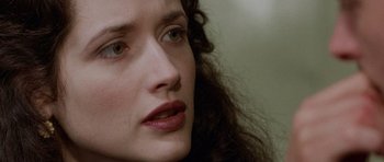 Movie still from “The Frighteners” (1996), directed by Peter Jackson – A woman's face with long , curly hair; Close Up shot, Over the shoulder angle