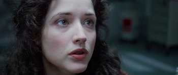 Movie still from “The Frighteners” (1996), directed by Peter Jackson – A woman's face with blue eyes; Close Up shot, Over the shoulder angle