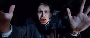 Movie still from “The Frighteners” (1996), directed by Peter Jackson – A person wearing a jacket; Close Up shot, Low angle