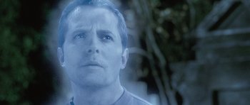Movie still from “The Frighteners” (1996), directed by Peter Jackson – A person looking at the camera; Close Up shot, Over the shoulder angle