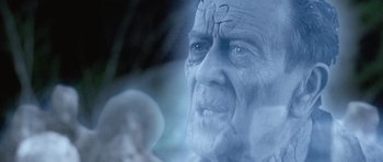 Movie still from “The Frighteners” (1996), directed by Peter Jackson – An old man with white hair and a bald head; Close Up shot, Over the shoulder angle