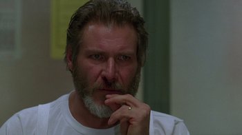 Movie still from “The Fugitive” (1993), directed by Andrew Davis – A person with a beard; Close Up shot, Low angle