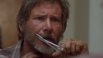 Movie still from “The Fugitive” (1993), directed by Andrew Davis – A person holding a pair of scissors; Close Up shot, Low angle