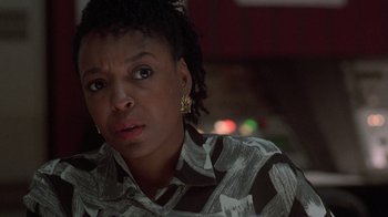 Movie still from “The Fugitive” (1993), directed by Andrew Davis – A person wearing a shirt; Close Up shot, Over the shoulder angle