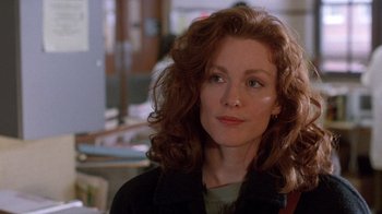 Movie still from “The Fugitive” (1993), directed by Andrew Davis – A person with curly hair; Close Up shot, Over the shoulder angle