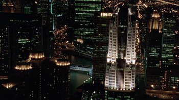 Movie still from “The Fugitive” (1993), directed by Andrew Davis – A view of a city at night from a helicopter; Extreme Wide shot, High angle