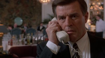Movie still from “The Fugitive” (1993), directed by Andrew Davis – A man talking on the phone; Close Up shot, Low angle