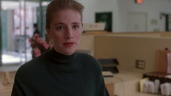 Movie still from “The Fugitive” (1993), directed by Andrew Davis – A person wearing a green sweater; Close Up shot, Over the shoulder angle