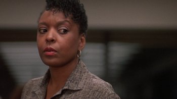 Movie still from “The Fugitive” (1993), directed by Andrew Davis – A person wearing a jacket; Close Up shot, Over the shoulder angle