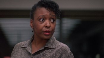 Movie still from “The Fugitive” (1993), directed by Andrew Davis – A person with an angry look on their face; Close Up shot, Low angle