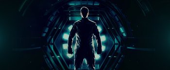 Movie still from “Popstar: Never Stop Never Stopping” (2016), directed by Akiva Schaffer – A man standing in front of an illuminated tunnel; Medium shot, Low angle