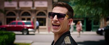 Movie still from “Popstar: Never Stop Never Stopping” (2016), directed by Akiva Schaffer – A person wearing sunglasses and a leather jacket; Close Up shot, Over the shoulder angle