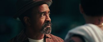 Movie still from “Popstar: Never Stop Never Stopping” (2016), directed by Akiva Schaffer – A person wearing a hat; Close Up shot, Over the shoulder angle