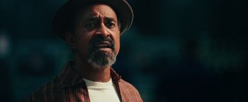 Movie still from “Popstar: Never Stop Never Stopping” (2016), directed by Akiva Schaffer – A person wearing a hat; Close Up shot, Over the shoulder angle