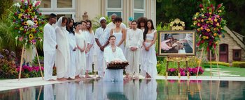 Movie still from “Popstar: Never Stop Never Stopping” (2016), directed by Akiva Schaffer – A group of people standing around a pool of water; Wide shot, High angle