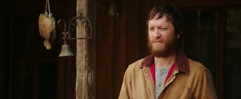 Movie still from “Popstar: Never Stop Never Stopping” (2016), directed by Akiva Schaffer – A man with a beard wearing a brown jacket; Close Up shot, Over the shoulder angle