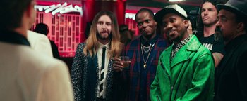 Movie still from “Popstar: Never Stop Never Stopping” (2016), directed by Akiva Schaffer – A group of men standing next to each other; Medium shot, Over the shoulder angle