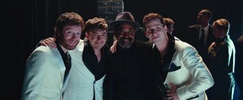 Movie still from “Popstar: Never Stop Never Stopping” (2016), directed by Akiva Schaffer – A group of men standing next to each other; Medium shot, High angle
